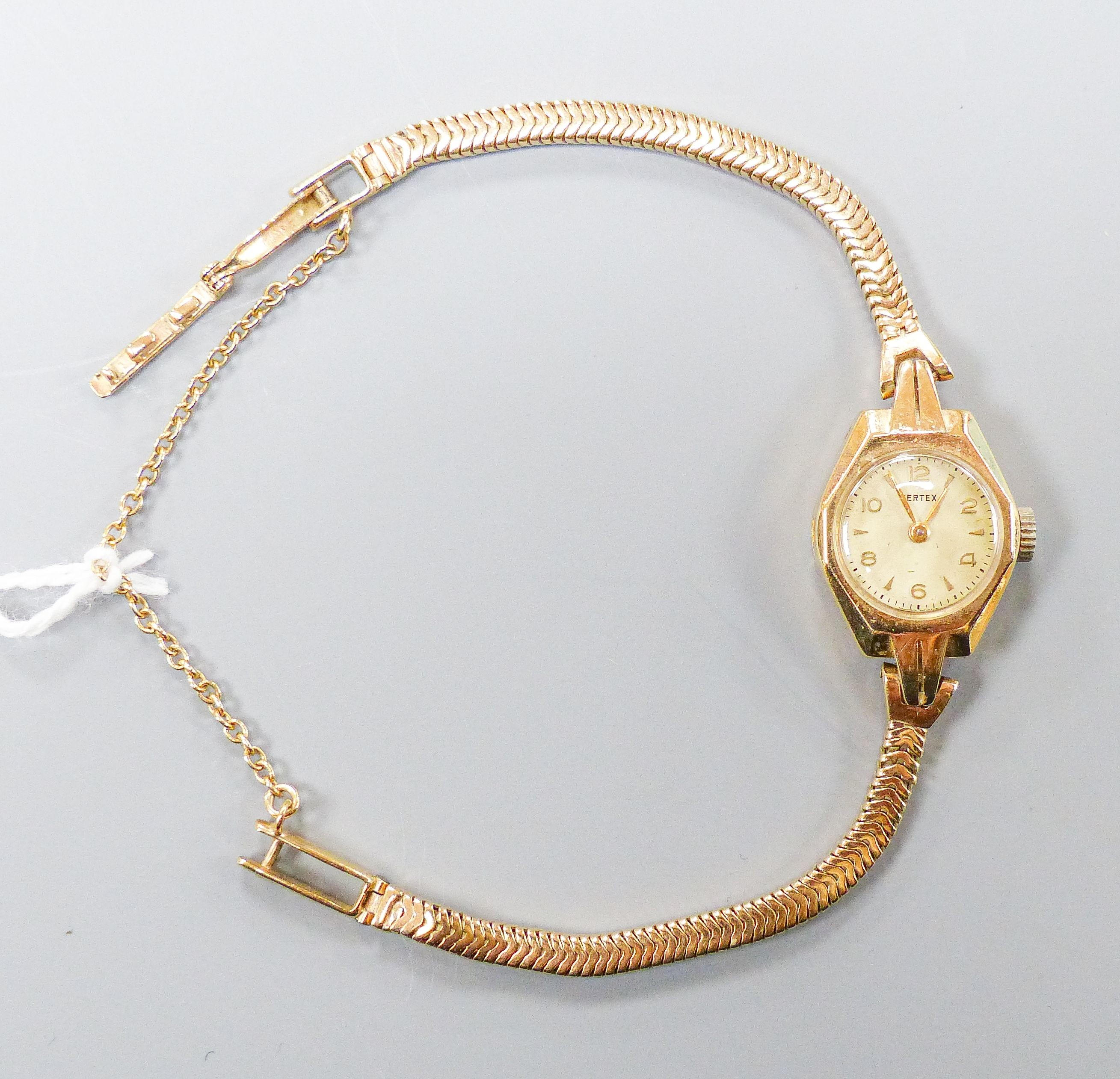 A lady's 9ct gold Vertex manual wind wristwatch on 9ct gold close flexible link bracelet, gross weight, 17.8 grams.